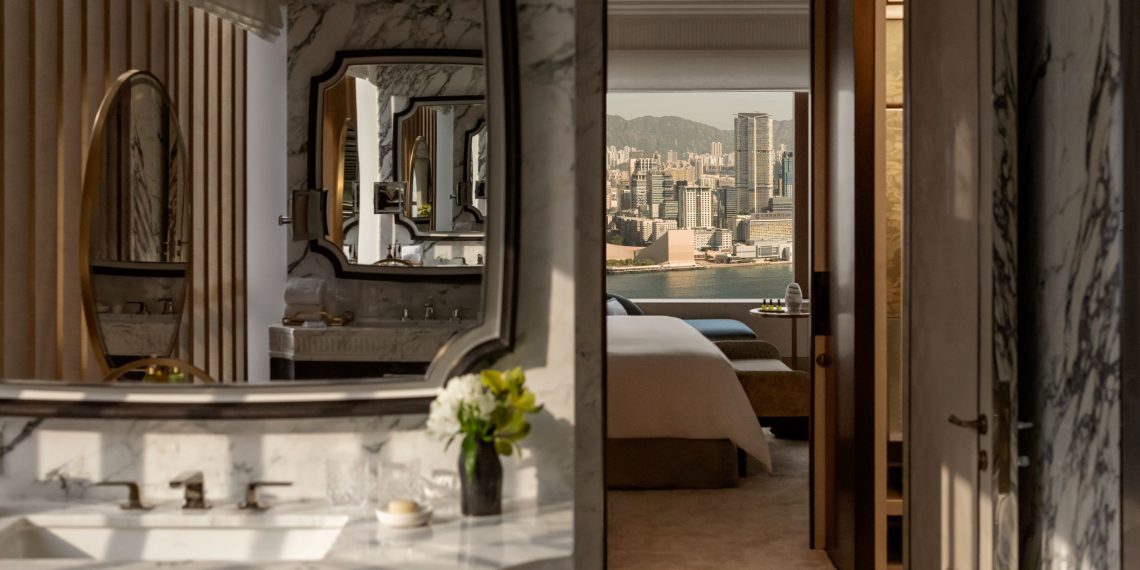 The Hong Kong Suite viewed from the bathroom and through the bedroom to the views of Victoria Harbour beyond
